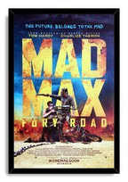 Mad Max: Fury Road framed wall art print with black border, bold yellow title, armed figures, motorcycle, and stormy blue sky.