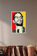 Malcolm X in a cozy movie room above a brown sofa with popcorn.