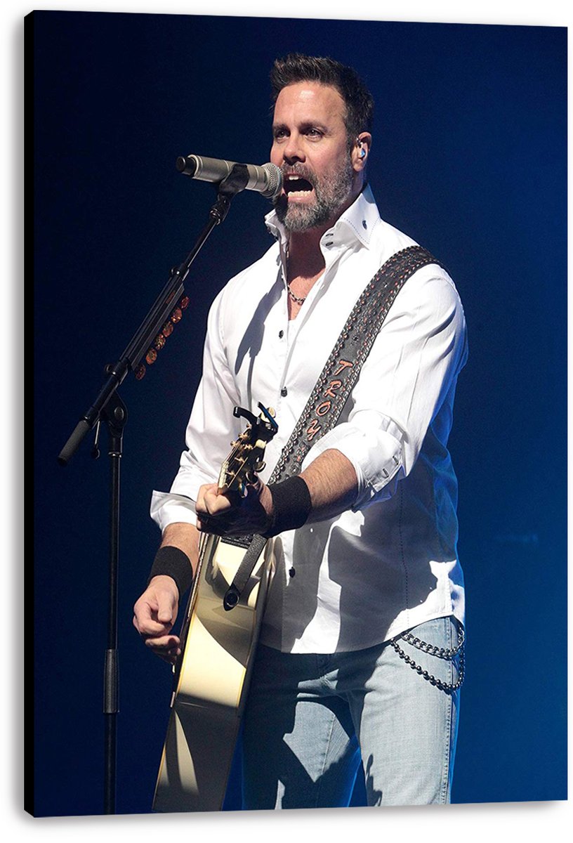Male singer canvas wall art print displays a musician in a white shirt singing at a microphone with an acoustic guitar against blue lighting.