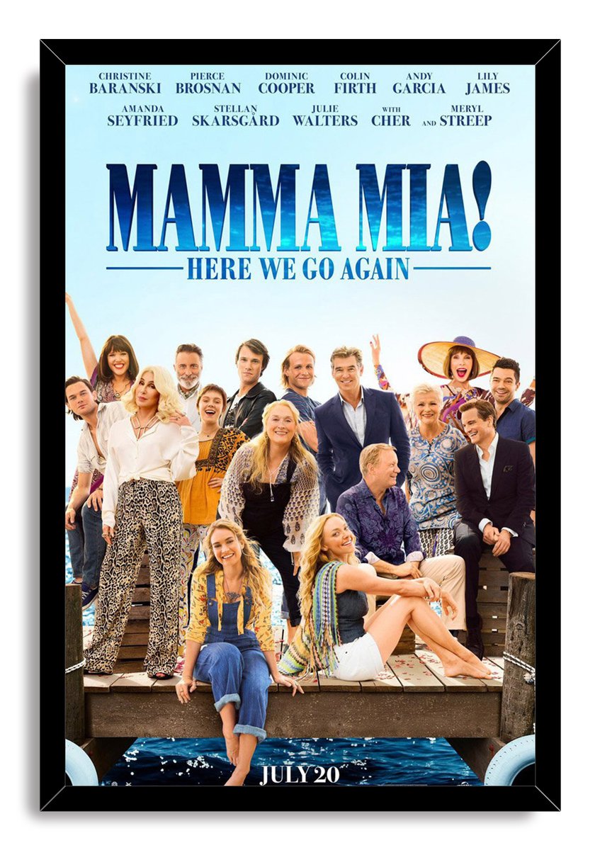Mamma Mia! Here We Go Again framed wall art print featuring the cast gathered on a wooden dock over blue water.