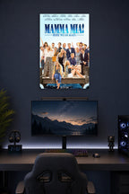 Mamma Mia! Here We Go Again Movie Cast in a gaming desk setup above a monitor.