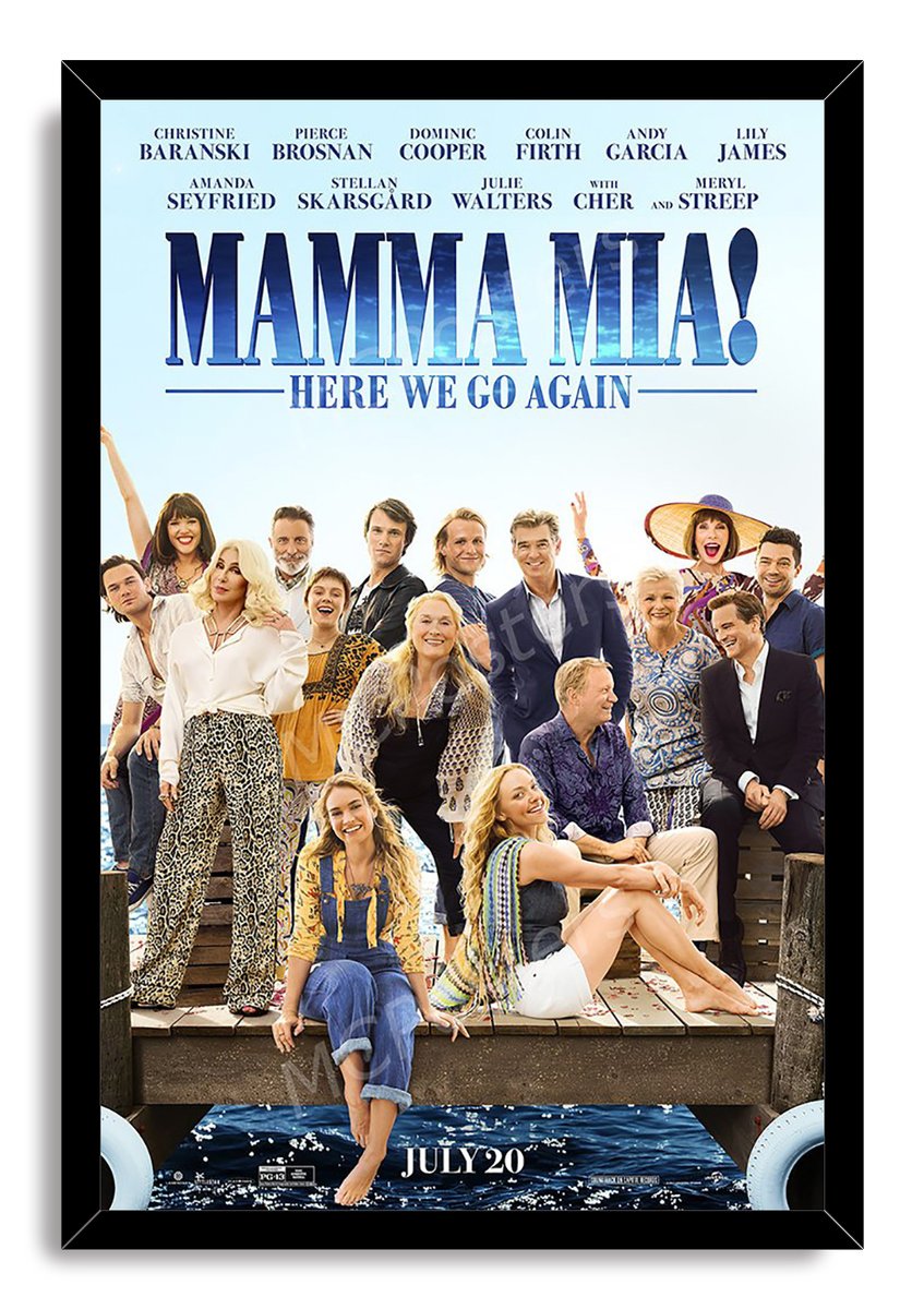 Mamma Mia! Here We Go Again framed wall art print with a black border, ensemble cast on a dock, and bright blue sea.