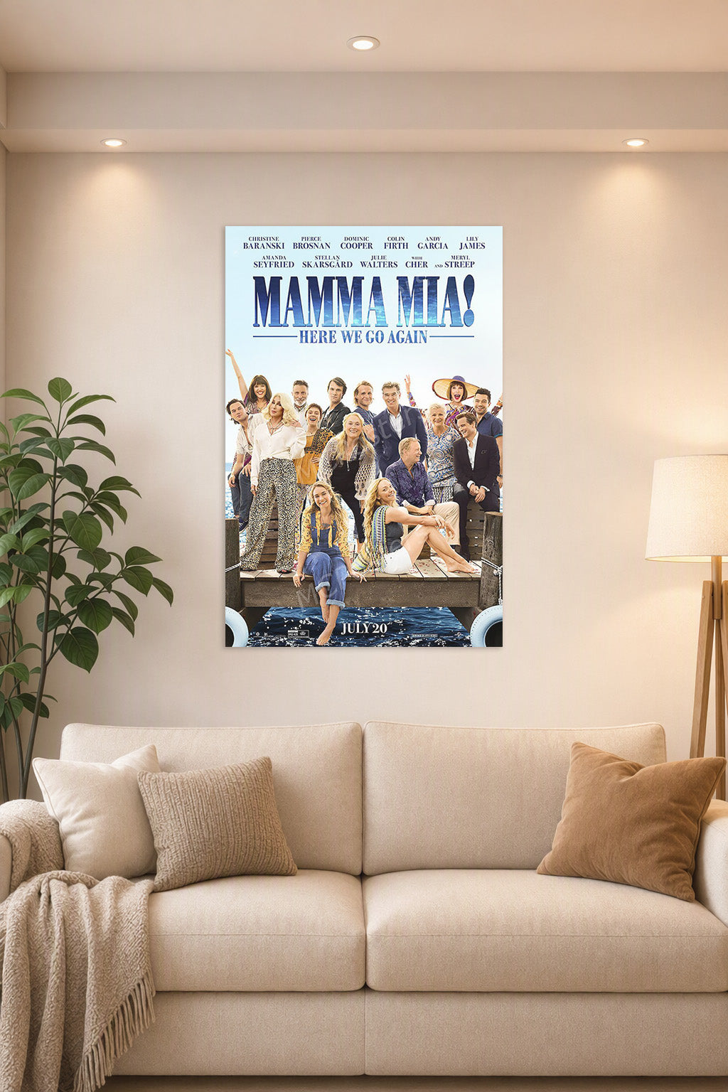 Mamma Mia! Here We Go Again Movie Poster in a bright living room above a beige sofa.