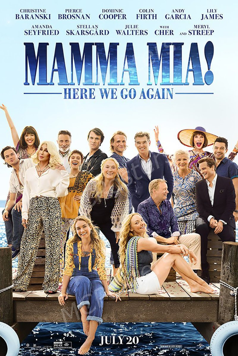 Mamma Mia! Here We Go Again movie poster wall art print with the ensemble cast smiling on a sunlit dock above blue water.
