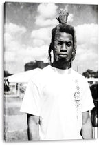 Canvas wall art print featuring a monochrome portrait of a man with raised dreadlocks and a white shirt outdoors.