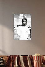 Man with Dreadlocks in a cozy movie room above a brown sofa with popcorn.