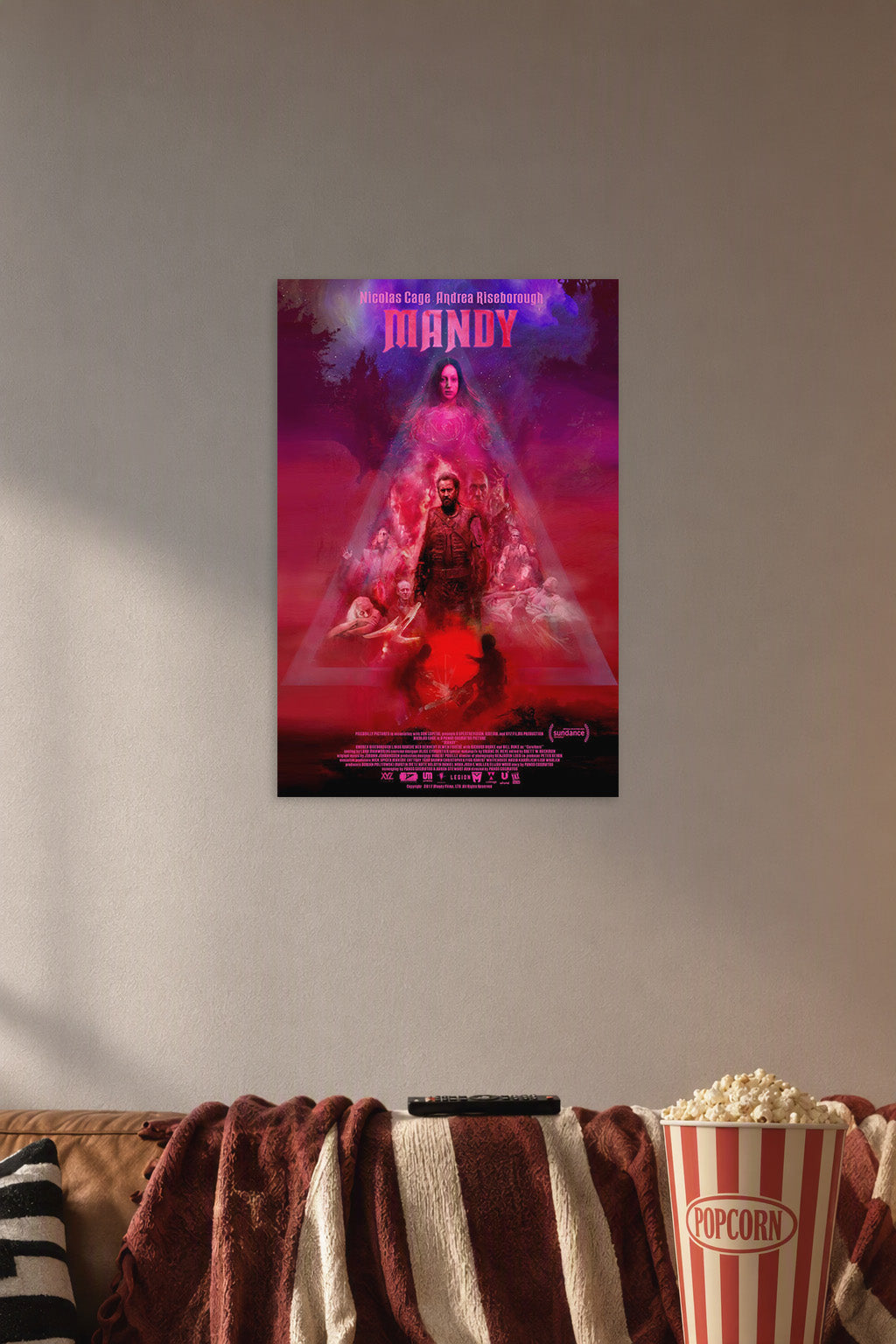 Mandy Movie Poster in a cozy movie room above a brown sofa with popcorn.
