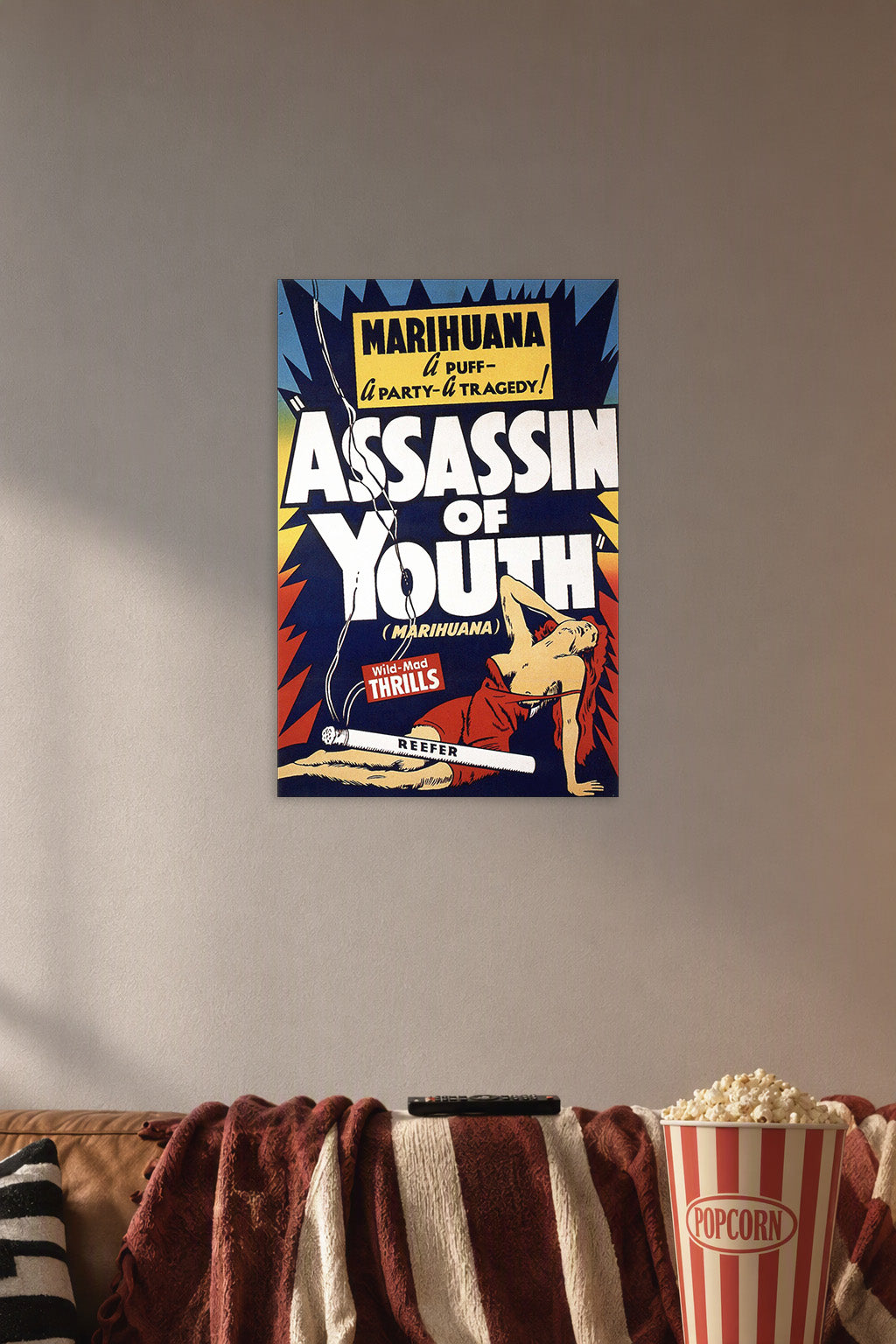 Marihuana Assassin of Youth Vintage Movie Poster in a cozy movie room above a brown sofa with popcorn.