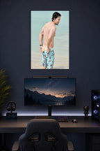 Mark Wahlberg in a gaming desk setup above a monitor.