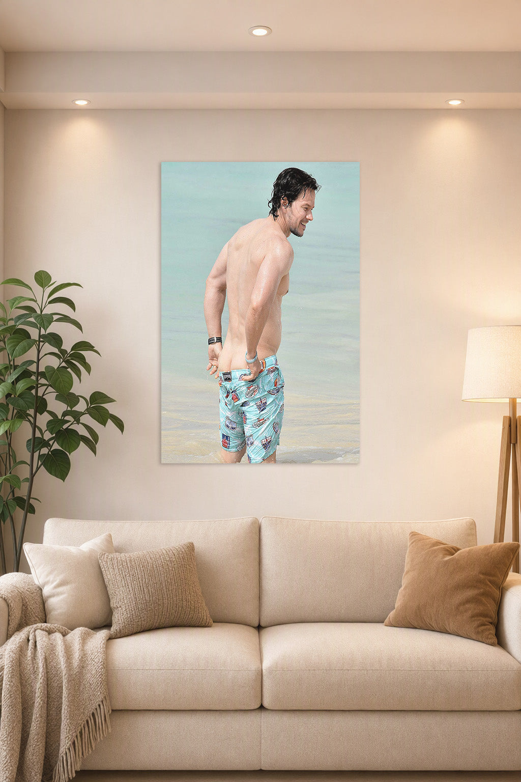 Mark Wahlberg in a bright living room above a beige sofa.