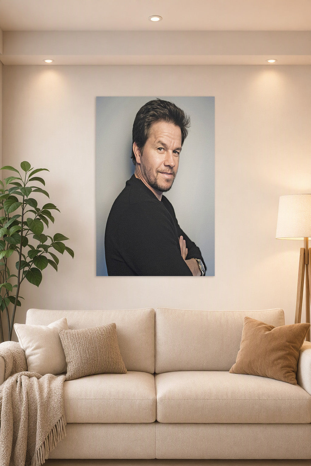 Mark Wahlberg in a bright living room above a beige sofa.