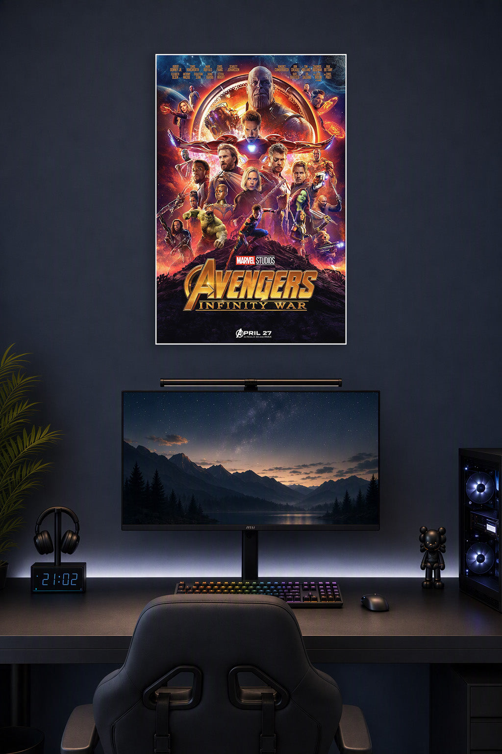 Marvel Avengers Infinity War Movie Poster in a gaming desk setup above a monitor.