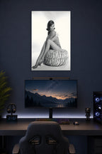 Mary Tyler Moore in a gaming desk setup above a monitor.