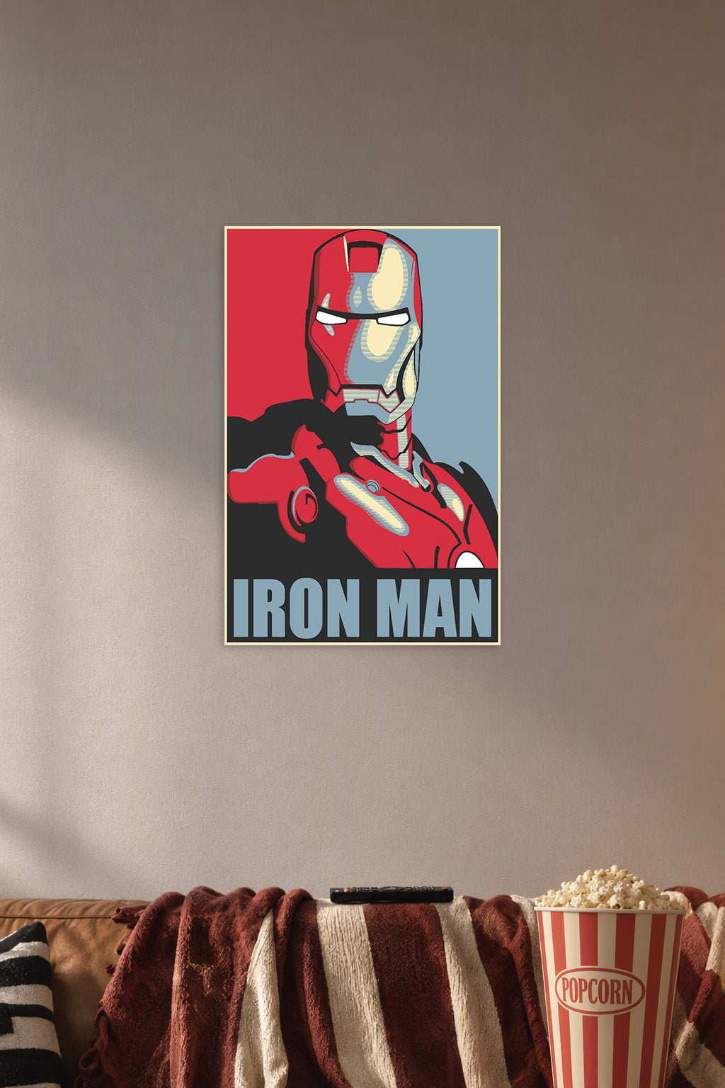 Master Iron Man Movie in a cozy movie room above a brown sofa with popcorn.