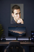 Matt Dillon in a gaming desk setup above a monitor.