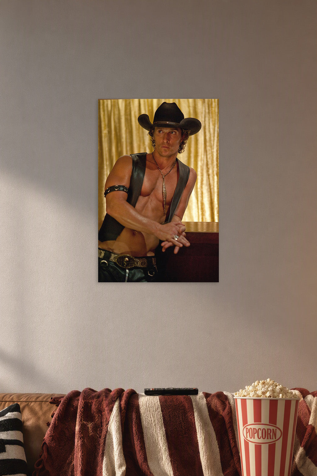 Matthew McConaughey Magic Mike in a cozy movie room above a brown sofa with popcorn.