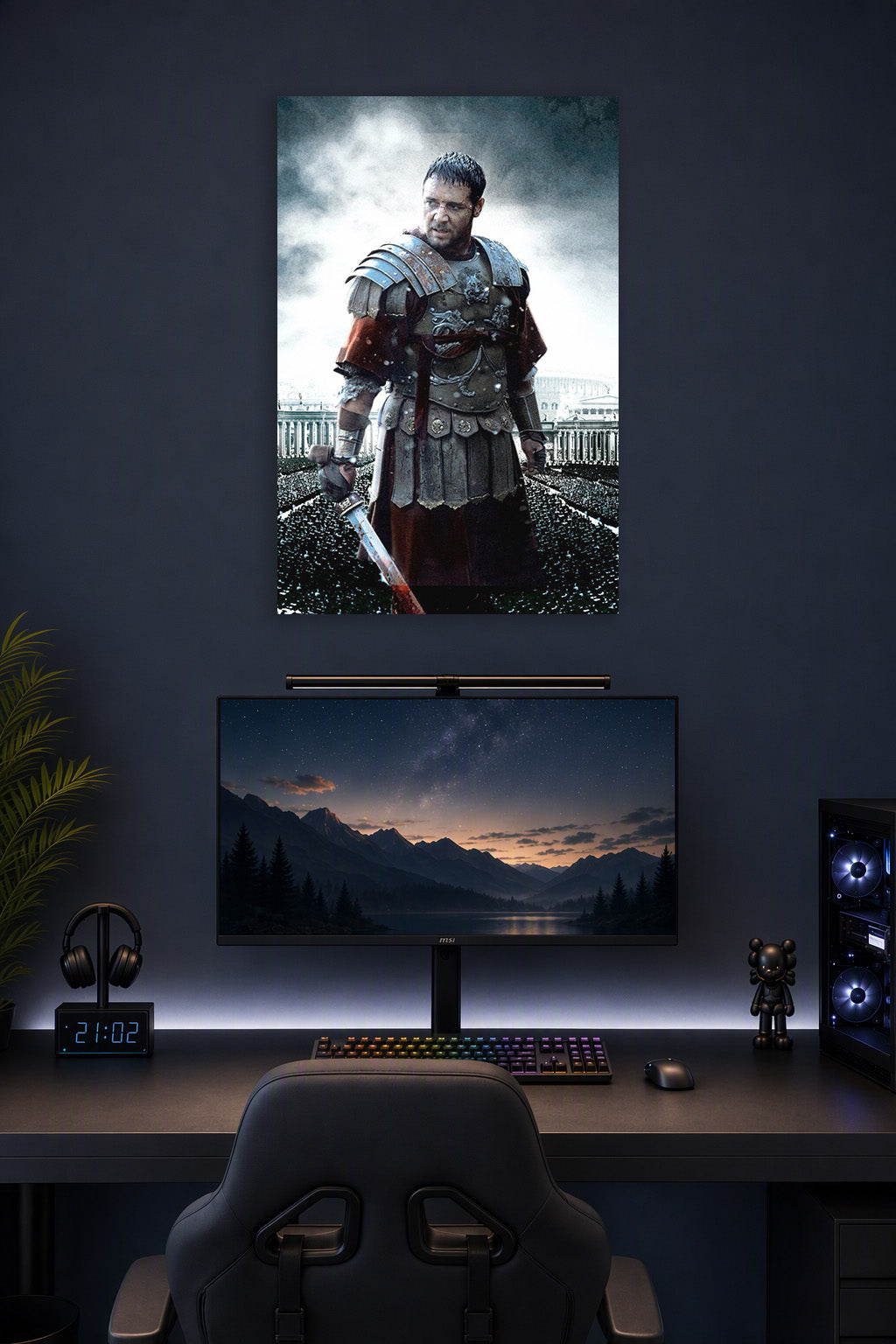 Maximus Gladiator in a gaming desk setup above a monitor.