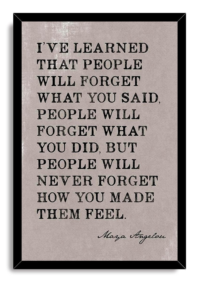 Maya Angelou quote wall art print in a black mitered frame, featuring distressed black typography on a pale gray background.