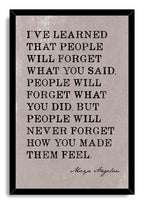Maya Angelou quote wall art print in a black mitered frame, featuring distressed black typography on a pale gray background.