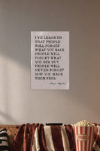 Maya Angelou Inspirational Quote 'How You Made Them Feel' in a cozy movie room above a brown sofa with popcorn.