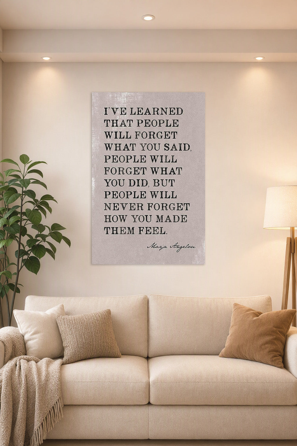 Maya Angelou Inspirational Quote 'How You Made Them Feel' in a bright living room above a beige sofa.