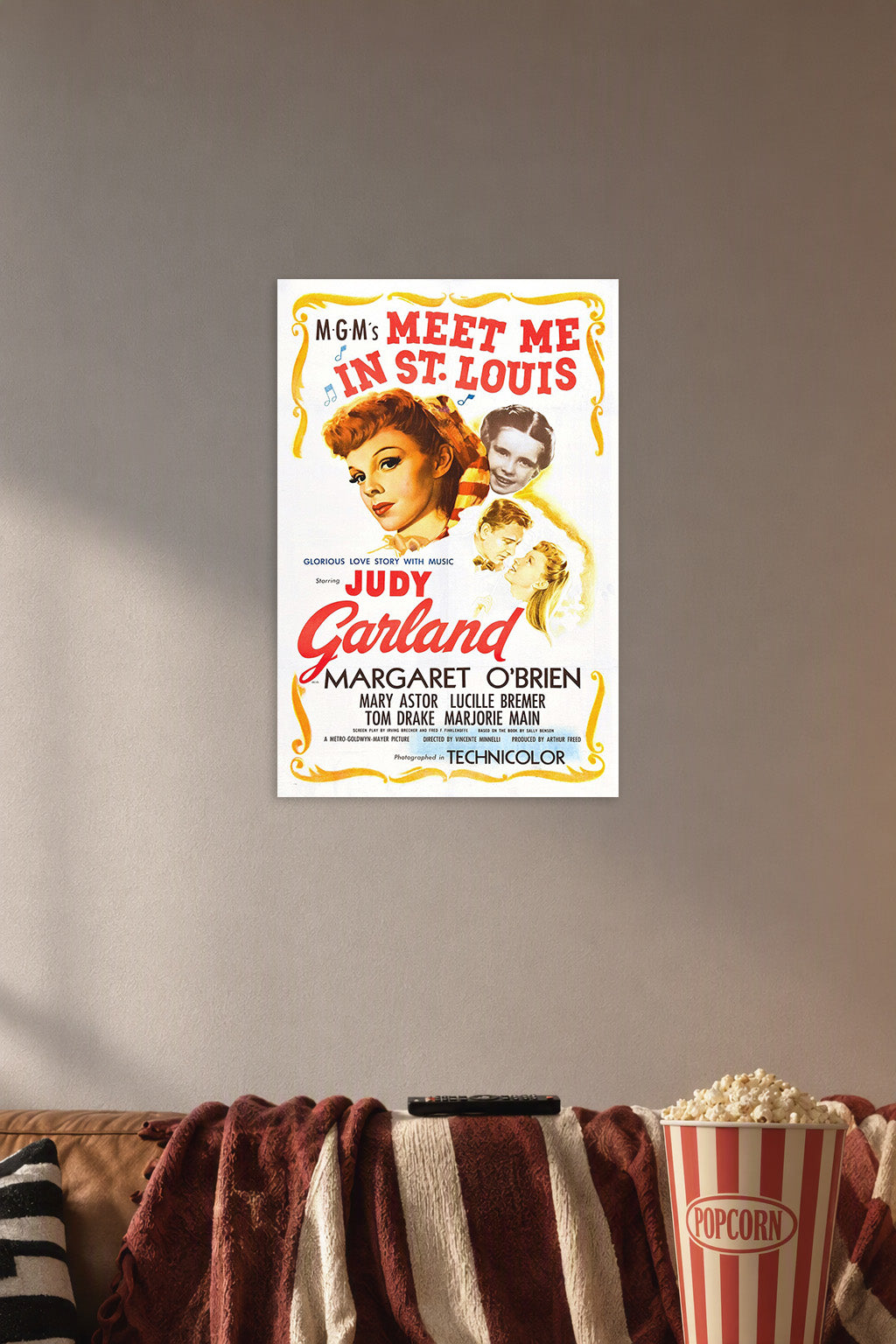 Meet Me in St. Louis Judy Garland in a cozy movie room above a brown sofa with popcorn.