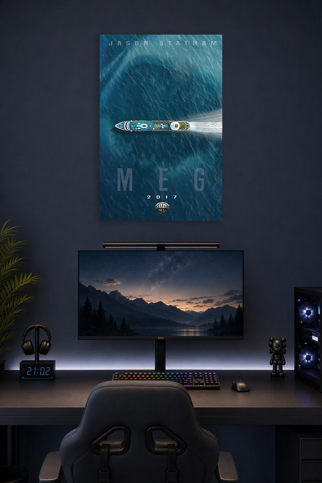 Meg Movie Jason Statham in a gaming desk setup above a monitor.