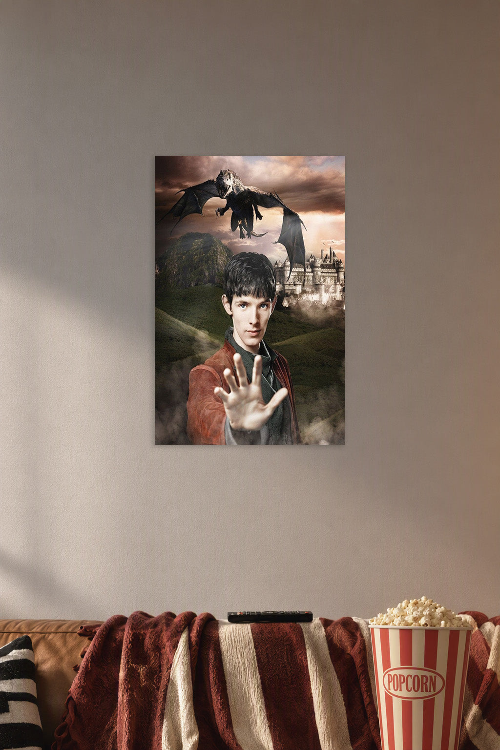 Merlin and Dragon in a cozy movie room above a brown sofa with popcorn.