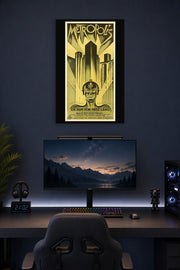 Metropolis Movie Poster in a gaming desk setup above a monitor.