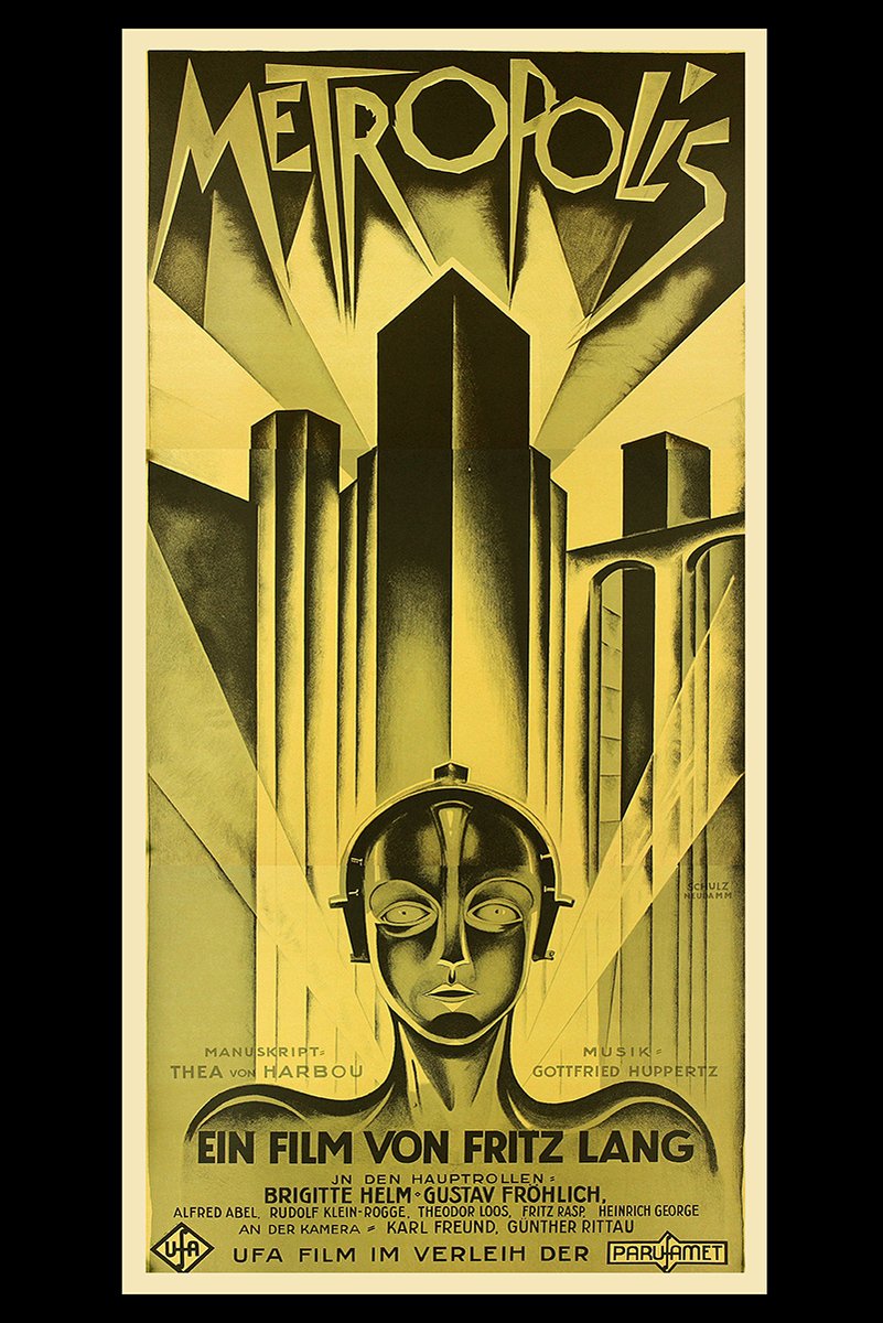 Metropolis movie poster wall art print with a robotic woman's face beneath towering Art Deco skyscrapers in black and gold.