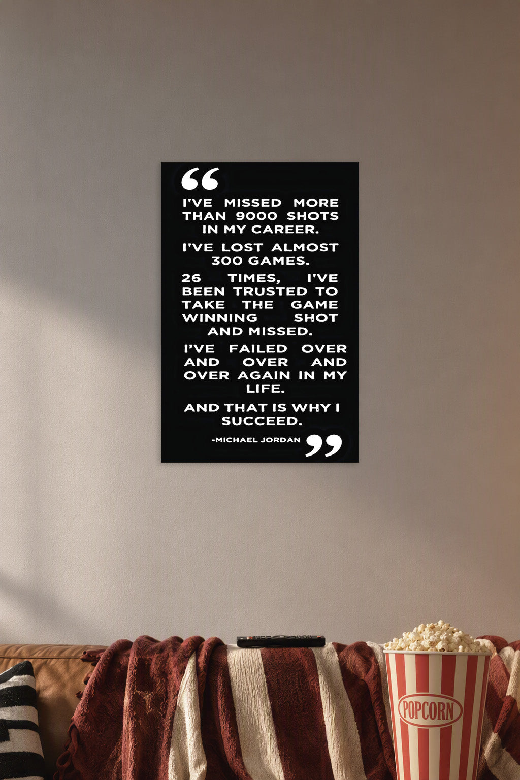 Michael Jordan Inspirational Quote in a cozy movie room above a brown sofa with popcorn.