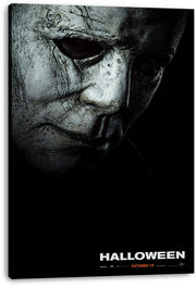 Michael Myers Halloween canvas wall art print displaying a close-up cracked gray mask, dark eye sockets, and orange October 19 text.