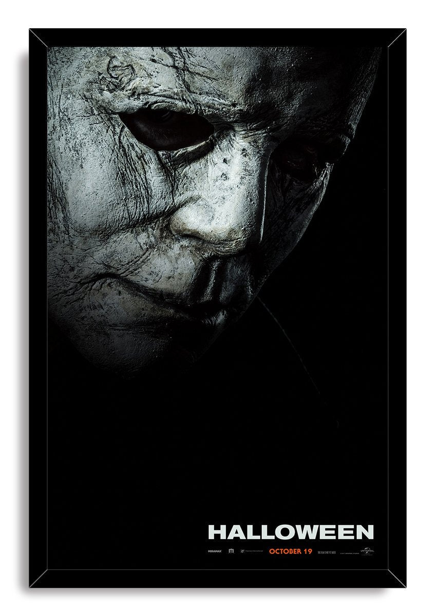 Michael Myers Halloween framed wall art print featuring a distressed mask against a black background with white title lettering.