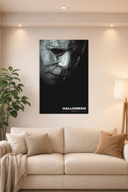 Michael Myers Halloween Movie Poster in a bright living room above a beige sofa.