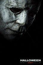 Michael Myers Halloween movie poster wall art print with a weathered pale mask emerging from black shadows above the title.