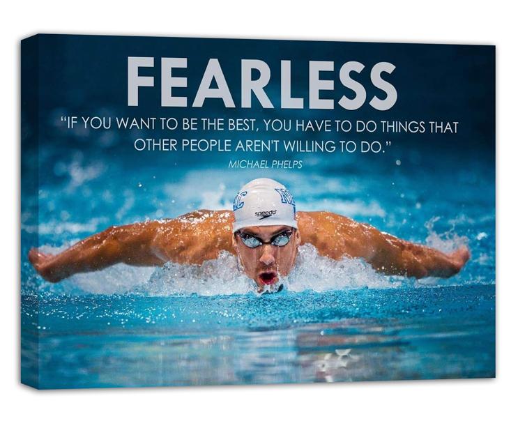 Michael Phelps motivational wall art canvas displays a butterfly swimmer splashing through a blue pool with the “FEARLESS” quote.