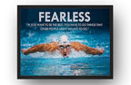 Michael Phelps motivational wall art print in a black frame depicts a swimmer performing butterfly under bold white “FEARLESS” text.