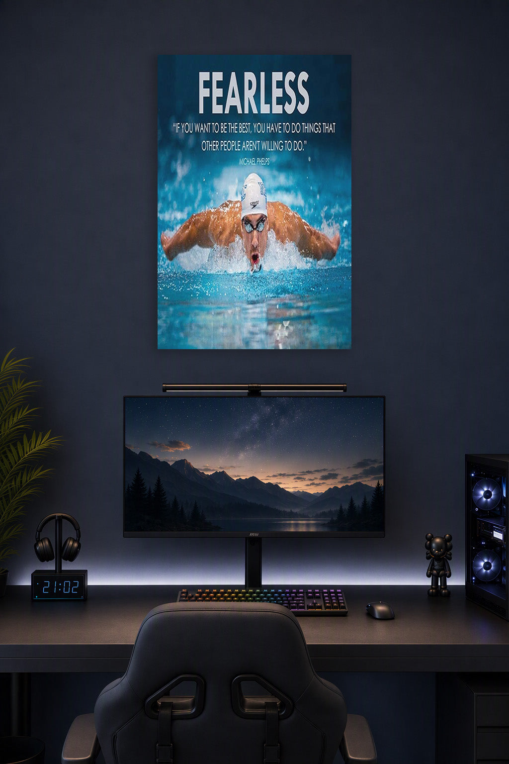 Michael Phelps Motivational Quotes HD Poster in a gaming desk setup above a monitor.