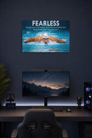 Michael Phelps Motivational Quotes HD Poster in a gaming desk setup above a monitor.