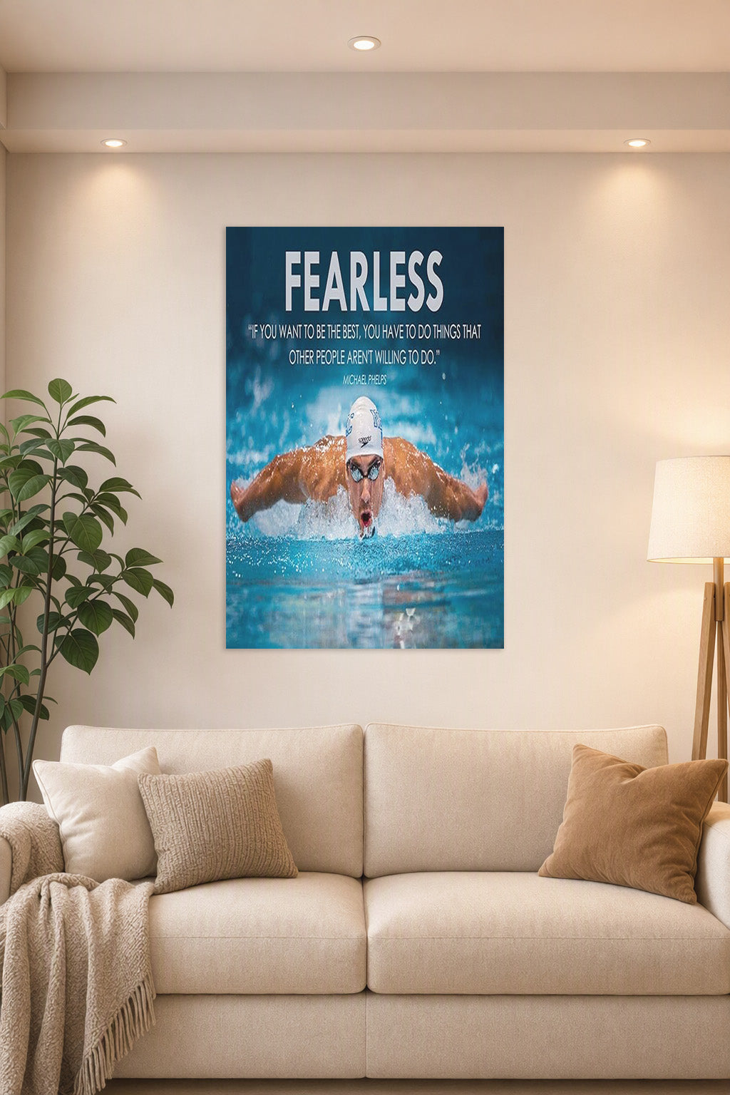 Michael Phelps Motivational Quotes HD Poster in a bright living room above a beige sofa.