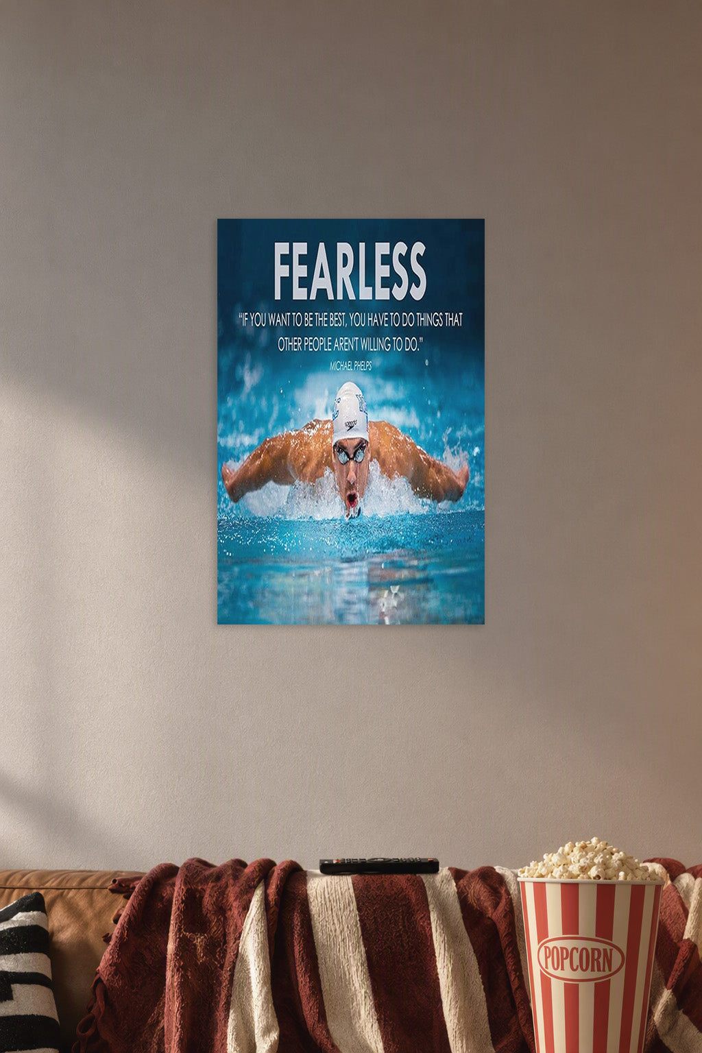 Michael Phelps Motivational Quotes HD Poster in a cozy movie room above a brown sofa with popcorn.