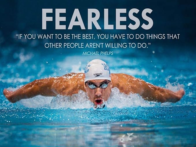Michael Phelps motivational poster features a swimmer in a white cap doing butterfly through bright blue water beneath the word “FEARLESS.