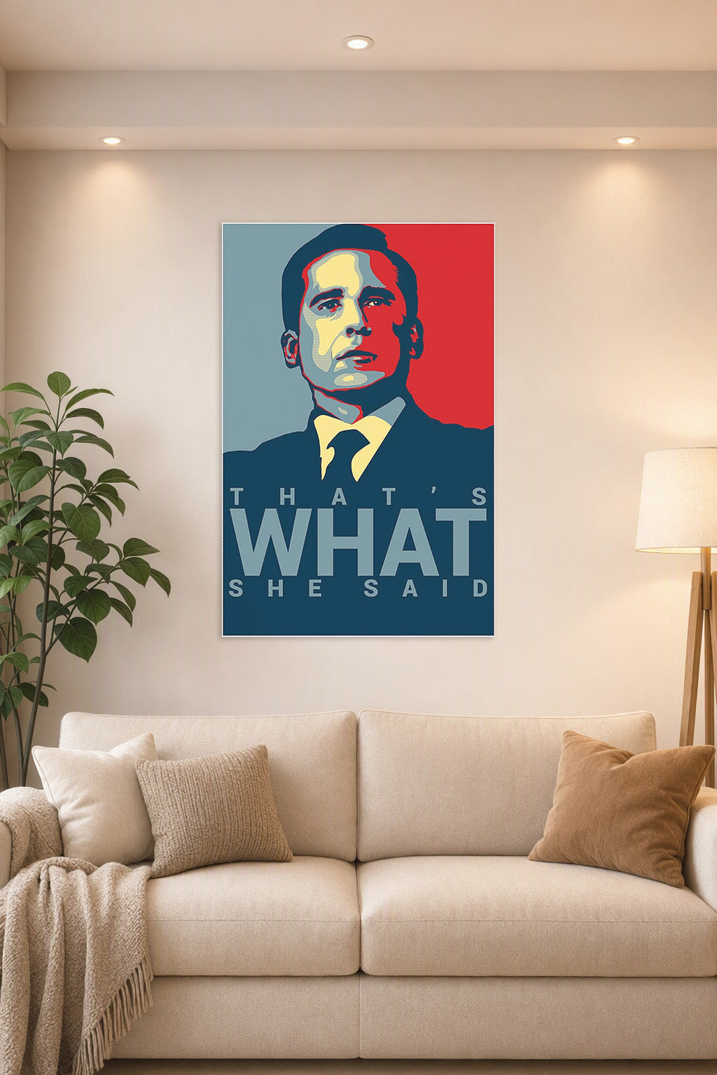 Michael Scott's Funny Motivational Poster."That's What" Print in a bright living room above a beige sofa.