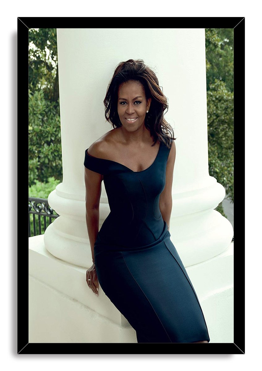 Michelle Obama framed wall art print presents her smiling beside a white column in a dark dress, enclosed by a black frame.