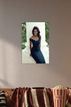 Michelle Obama in a cozy movie room above a brown sofa with popcorn.