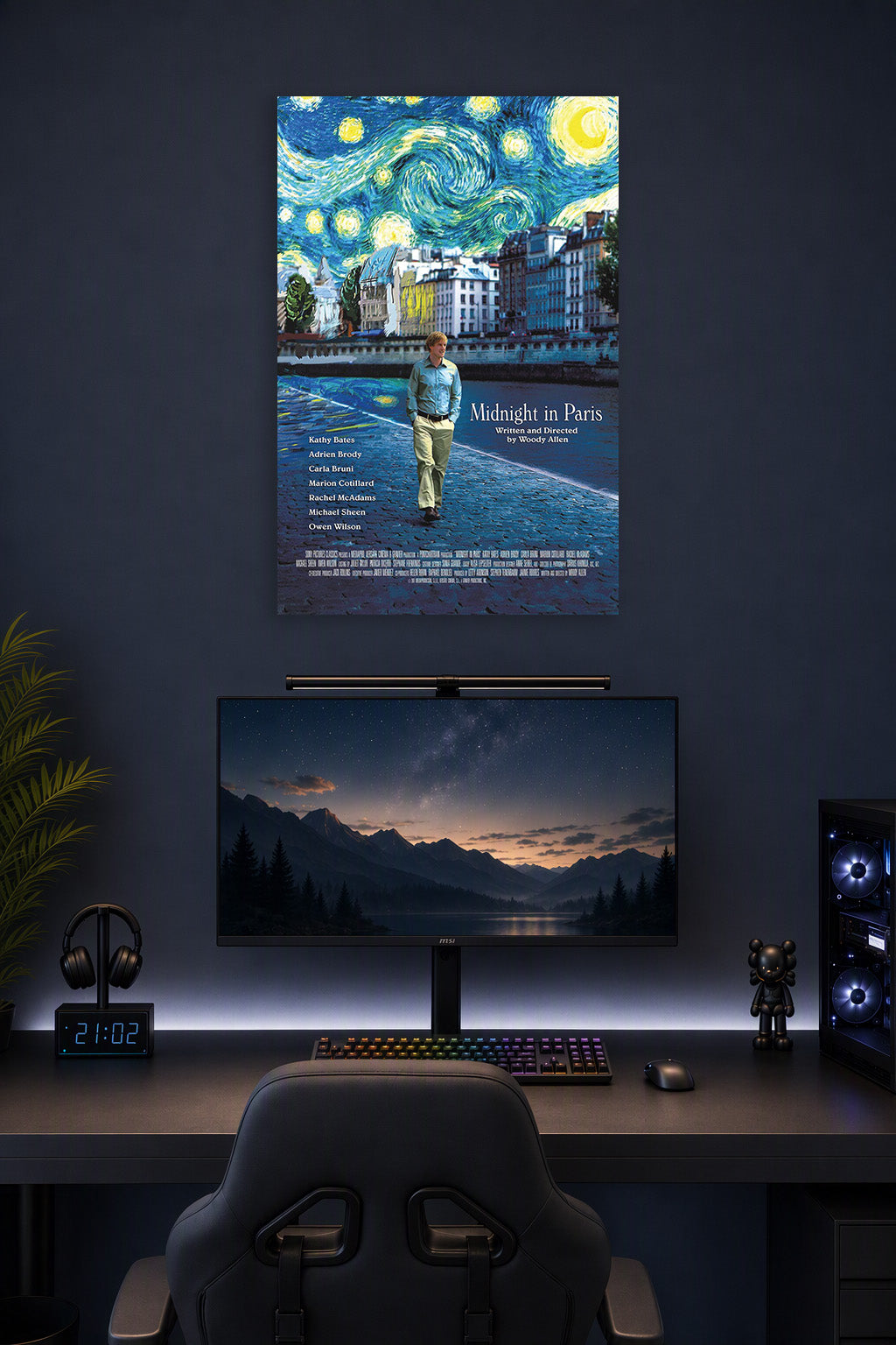 "Midnight in Paris" Movie Owen Wilson in a gaming desk setup above a monitor.