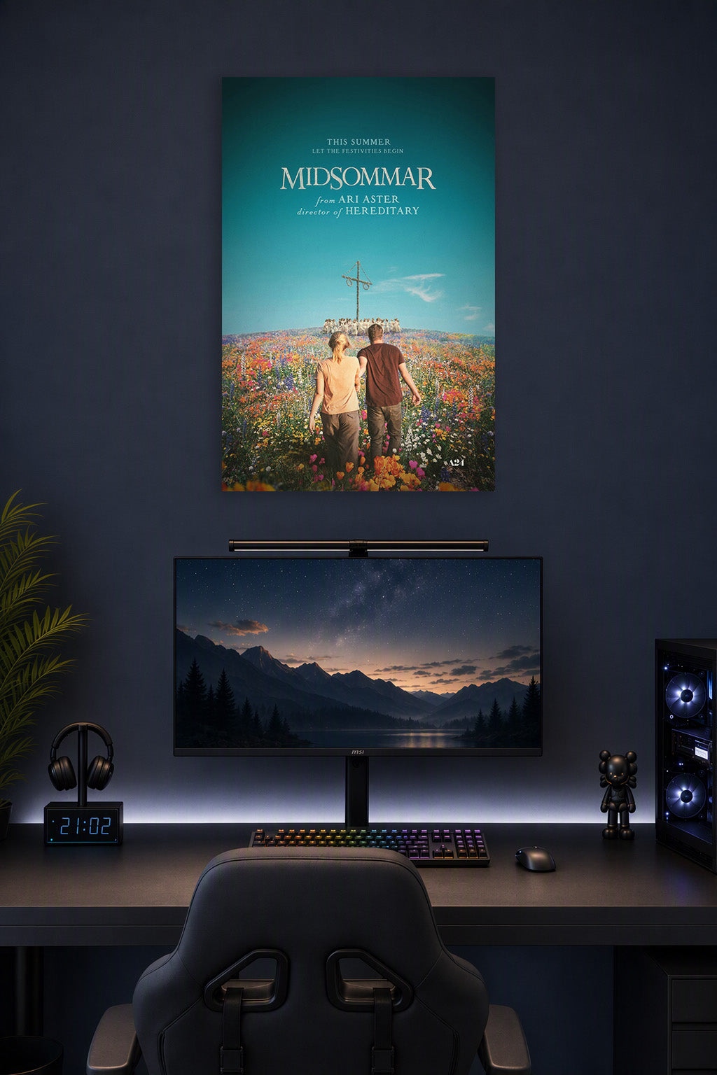 Midsommar in a gaming desk setup above a monitor.