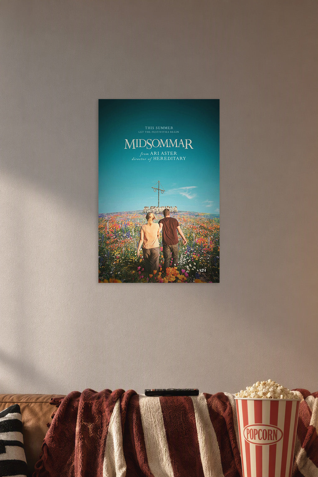 Midsommar in a cozy movie room above a brown sofa with popcorn.