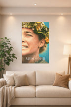 Midsommar Movie Poster in a bright living room above a beige sofa.