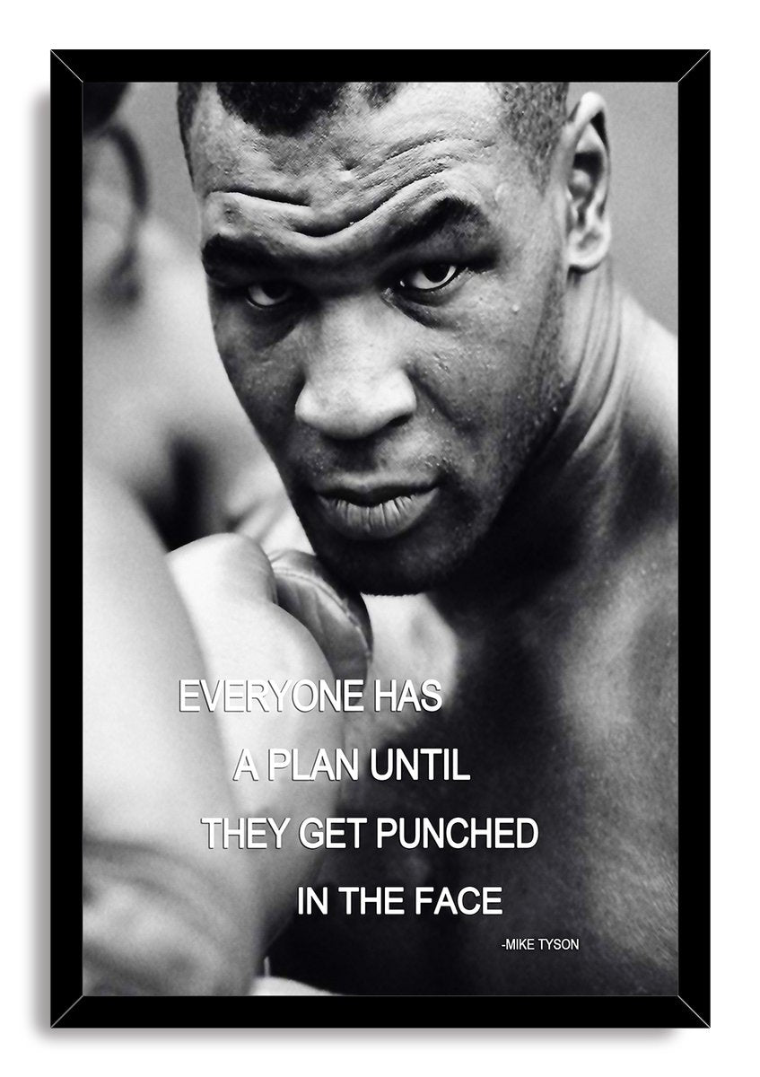 Mike Tyson framed wall art print in black, with a monochrome close-up boxing portrait, raised glove, and motivational quote.